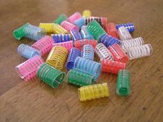 many different colored toothbrushes on a wooden table