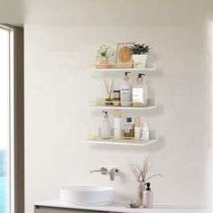 the bathroom is clean and ready to be used as a place for personal care items