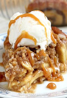 an image of apple pie with ice cream and caramel syrup on it's top