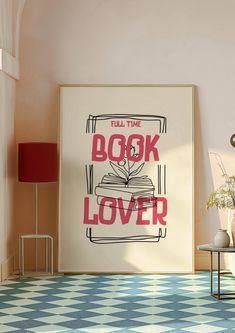 a book lover poster on the wall next to a table with flowers in vases