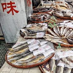 baskets filled with fish sitting on top of a table