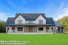 a large white house sitting on top of a lush green field