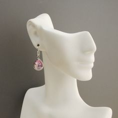 "Sparkling pink earrings. Rhodium plated pink glass teardrops with rope trim. The glass drop earrings measure 1 1/4\" long and the ear wires are sterling silver. A dazzling shade of cotton candy pink. Perfect for your bridesmaid gift. * rhodium plated teardrop (13 x 10mm) * sterling silver ear wires The earrings will arrive gift boxed. The matching necklace, as shown in picture #5, is available in my shop at: https://www.etsy.com/listing/193511812/light-pink-necklace-pink-bridesmaid?ref=shop_hom Hypoallergenic Pink Jewelry For Formal Occasions, Pink Elegant Clip-on Earrings For Anniversary, Elegant Pink Clip-on Earrings For Anniversary, Elegant Pink Sterling Silver Teardrop Earrings, Pink Dangle Teardrop Earrings For Gift, Teardrop Clip-on Earrings For Wedding, Pink Round Crystal Earrings For Formal Occasions, Wedding Teardrop Clip-on Earrings, Pink Earrings With Lever Back For Anniversary