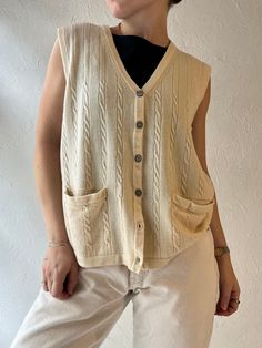 - Tabi cream cable knit vest - Shell buttons - 100% wool - Model is 5' for reference - Tagged L  Chest: 19" Length: 22" We are not responsible for lost, stolen, or damaged packages once they have been shipped. Any additional customs duties or taxes incurred on international orders are the responsibility of the buyer. Please note that our items are vintage and may have minor flaws or imperfections due to their age, which adds to their unique character. Sleeveless Sweaters, Cable Knit Vest, Sweater Vest Mens, Sleeveless Jumper, Wool Vest, Shell Buttons, Sleeveless Sweater, Knit Vest, Sweater Vest