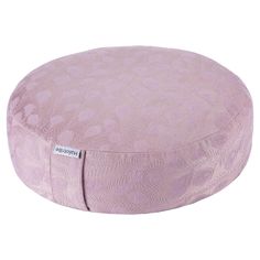 a pink round ottoman cushion with an animal print pattern on the front and back side