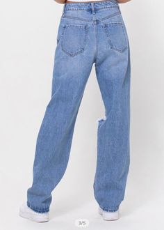 These baggy jeans are a fun fit to try out the 90s trend. They are heavily distressed with a straight leg fit. Mid rise. 100% Cotton. Inseam: 31, Rise: 12. Model is wearing a size 3. Runs small. We recommend sizing up. 90s Trends, The 90s, Baggy Jeans, Levi Jeans, Mom Jeans, Mid Rise, Straight Leg, Shop Now, How To Wear