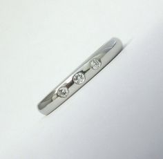 TIFFANY & Co. Platinum Elsa Peretti 3 Diamond Stacking Band Ring 5 Metal: Platinum Sizes: 5 Width: 2.7mm Weight: 5.10 grams Diamond: 3 round brilliant diamonds, carat total weight .06 Hallmarked: TIFFANY&Co. ©PERETTI PT950 SPAIN Condition: Excellent condition, like new. It comes with Tiffany pouch and box Value: $1,600 Authenticity guaranteed Elsa Peretti Tiffany, Diamond Stacking Band, Tiffany Ring, Stacked Diamond Bands, Tiffany Rings, Nyc Shopping, Stacking Bands, Elsa Peretti, Tiffany & Co.