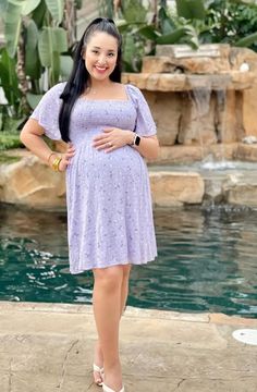 A floral print maternity dress featuring a squared neckline, short sleeves, a smocked bodice, and a lined skirt. Squared Neckline, Lavender Floral, Lined Skirt, Bump, Square Neck