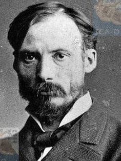 an old black and white photo of a man in a suit with a goatee