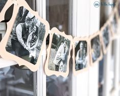 an old photo is hanging on a clothes line in front of a window with pictures