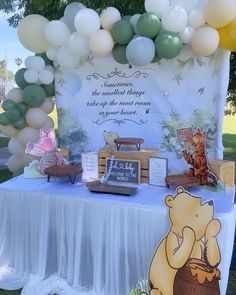 a winnie the pooh birthday party with balloons