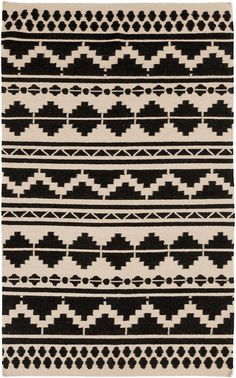 a black and white rug with geometric designs