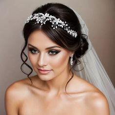 a woman wearing a wedding veil and tiara