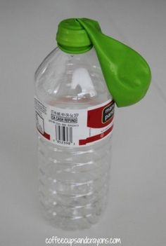 a plastic water bottle with a green cap