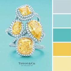 a yellow and white ring with diamonds on it in front of a color scheme for tiffany & co