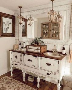 an old fashioned bathroom vanity with two sinks and mirrors above it, along with a rug on the floor