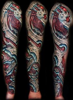 the legs are covered with tattoos and designs on them, including an abstract design in red, white and blue