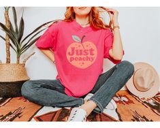 The sun's out, music's on, and life is Just Peachy! Celebrate the good times with this cute fruit tee. Comfort Colors Vintage Style Garment-dyed T-shirt for women or men. Great as a gift to cheer up a friend. ✨Product Features✨ - Soft-washed, pre-shrunk cotton for long-lasting comfort and a consistently great fit - Double-stitching throughout makes tee highly durable - Garment dye process gives T-shirt a cool vintage look - Tubular knit = no annoying side seams - Made using 100% US cotton that i Trendy Peach Relaxed Fit T-shirt, Trendy Relaxed Fit Peach T-shirt, Peach Relaxed Fit T-shirt With Letter Print, Relaxed Fit Peach T-shirt With Letter Print, Trendy Heather Peach Top With Graphic Print, Tshirt For Women, Happy Times, Cute Fruit, Just Peachy