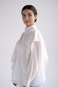 Sheer long sleeve blouse with pleated arms Button closure in back Fits true to size, loose fit Model wears size S Model is 167 cm/ 5'6" with 26 waist, 34 bust, 36 hips 65% cotton, 35% polysterDry Clean OnlyMade in Armenia