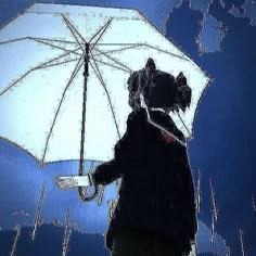 a person holding an umbrella in the rain