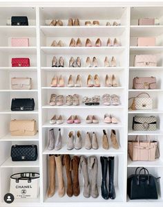 a white closet filled with lots of shoes and handbags on top of shelving units