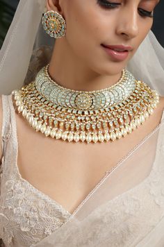 This necklace is the epitome of opulence and charm. Created employing the traditional meenakari work, the necklace set is effortlessly perfect. The cascading elements in this choker so gracefully crown the neck. Necklace Closure - Adjustable Dori Earrings Closure - Push Back Style Tip - Versatility and elegance being the strong suit, we leave a lot to your imagination for how you want to dress your jewels your way and embrace your personal style. Meenakari necklaces are great to be worn for trad Turquoise Temple Jewelry For Wedding, Turquoise Kundan Jewelry For Wedding, Turquoise Meenakari Necklace For Wedding, Turquoise Jeweled Wedding Jewelry, Turquoise Wedding Jewelry With Jewels, Bridal Choker Necklace, Neck Necklace, Necklace Closure, Stone Necklace Set