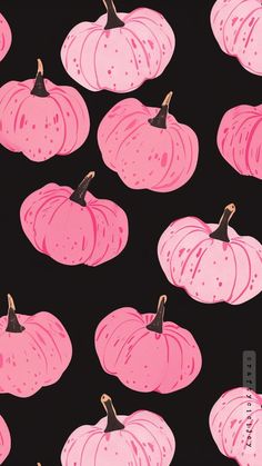 pink pumpkins on black background