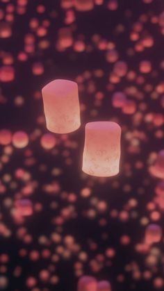 two square lights floating in the air with pink and red bubbles around them on a black background