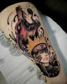 a man's leg with a tattoo on it and an image of a demon