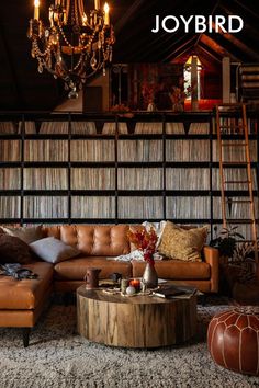 a living room filled with furniture and a chandelier