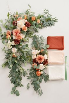 flowers and greenery laid out on top of each other