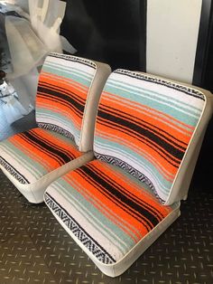 the seat covers are striped and orange