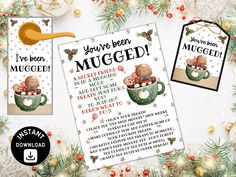 two christmas cards with the words you've been mugged and an image of a baby in a cup