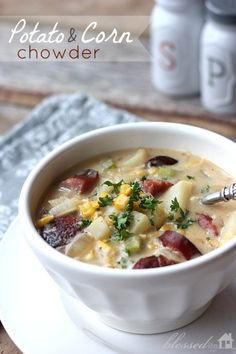 a bowl of potato and corn chowder on a plate