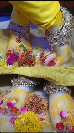 the feet are decorated with flowers and jewels on display in this photo, while someone's foot is wearing yellow shoes