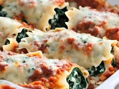 a casserole dish filled with spinach and cheese