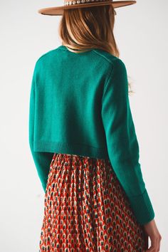 Evoking memories of the 90s, this high neck cropped green jumper provides an oversized fit that makes you look tomboy-inspired yet feminine. Its boxy above-the-waist cut gives you an extra layer on chilly days. It boasts of a turtleneck neckline, long sleeves, ribbed trims, and super soft fabric that is made from 50% Viscose, 28% Polyester, and 22% Polyamide. The model is 5’10” with measurements of 32-25-35 and is wearing a size small. The S-M-L sizing equates to US sizes of 4, 6, and 8 respecti Green Crew Neck Cropped Sweater For Fall, Green Cropped Sweater For Winter, Green Crew Neck Cropped Sweater, Green Crew Neck Cropped Sweater For Winter, Green Cropped Sweater For Fall, Green Cropped Sweater Crew Neck For Winter, Green Cropped Sweater, Crew Neck For Winter, Boxy Fit Cropped Crew Neck Sweater For Winter, Boxy Fit Crew Neck Cropped Sweater For Winter