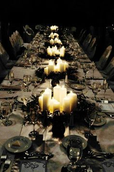 a long table with many candles on it