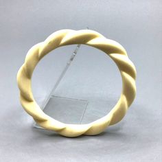 "Vintage Retro Plastic Bangle Bracelet Cream Off White Twisted Braided Design This listing is for a retro off white braided design bangle designer marked: unmarked condition: very good measurement: 2.5\" in diameter Please be aware that pictures are an important part of my description, please look at all photos and zoom in if needed. All my items are previously owned, I inspect everything carefully and try my best not to list items with major flaws or damage. Vintage and antique items often have Vintage Beige Bracelet, Vintage Adjustable Cream Bracelets, Vintage Adjustable Cream Bracelet, Vintage Handmade Cream Bracelets, Handmade Vintage Cream Bracelets, Vintage Cream Bangle Jewelry, Cream Vintage Bangle Jewelry, Vintage Cream Bracelet, Plastic Bangles