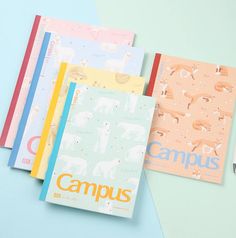 four notebooks with the word campus printed on them, lined up next to each other