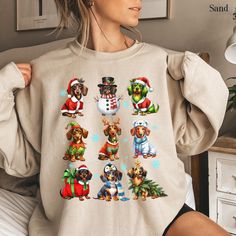 Stay cozy and festive with our dachshund christmas sweatshirt! This adorable dachshund christmas shirt is the perfect way to celebrate the holidays while staying warm. Designed for dachshund moms and dog lovers, this christmas crewneck is a fun and festive choice for holiday gatherings or lounging at home. It's also a great dog lover gift or dachshund new year shirt for any doxie fan. Whether you're decking the halls or unwrapping gifts, this dachshund mom shirt adds a festive touch to your holiday wardrobe! 🌟 HOW TO ORDER 🌟 Peek at the Pics: Take a moment to browse all the photos and fall in love with your new favorite tee. Pick Your Size & Color: Choose the perfect size and color combo to match your style. Add to Cart: Pop it in your cart, and if you want to add more goodies, feel free Winter Dog Print Crew Neck Top, Winter Crew Neck Top With Dog Print, Dog Mom Tee, New Year Shirt, Dachshund Mom, New Years Shirts, Dachshund Christmas, Christmas Crewneck, Color Magic