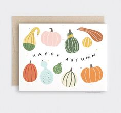 a card with pumpkins and gourds that says happy autumn on the front