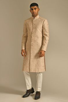 Pink dust sherwani with floral embroidered motifs, front button placket and patch pocket. Comes with contrast straight pants.
Component: 2
Embroidered
Neckline: Mandarin
Sleeve Length: Full
Fabric: Silk
Color: Pink
Closure: Sherwani: Front buttons - Aza Fashions White Pants Fit, Peach Sherwani, Sherwani Design, Groom Sherwani, Nikah Outfit, Embroidered Sherwani, Indian Groom Wear, Nikah Dress, Mens Kurta Designs