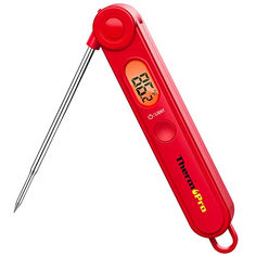 a red thermometer with two needles sticking out of it's back end