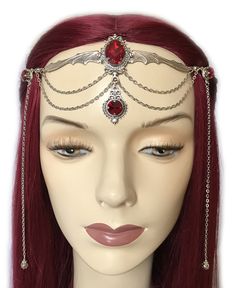 "This gothic vampire inspired headpiece is made with a large antiqued silver plated bat, filigree beads, findings and draping chains. It is accented with sparkling DARK RUBY RED glass rhinestones/jewels. Centerpiece is worn with silver plated cable chain. Decorated portion is 6 3/4\" wide and 2 1/2\" tall in the center. Side hanging strands are 6 1/2\" in length. Headpiece is adjustable 21-24\" with a lobster clasp and chain extender in the back. If you would like a different length or stone col Gothic Body Jewelry For Halloween Party, Gothic Halloween Party Body Jewelry, Gothic Silver Jewelry For Costume Party, Silver Costume Accessories For Halloween, Silver Costume Accessories For Halloween Fantasy Events, Adjustable Gothic Costume Accessories For Fantasy Events, Silver Fantasy Headpiece For Costume Party, Silver Fantasy Costume Accessories For Fantasy Events, Silver Gothic Costume Accessories For Cosplay