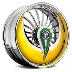 a yellow and white wheel with a green stripe on the center, in front of a white background