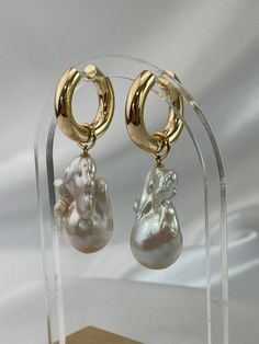 New Large Gold round hoop earrings with removable dangling jumbo baroque pearls! This is a versatile hoop earrings, you can wear as is with the dangling pearl or remove the pearl charm and wear as a simple gold hoop earrings.  You can also replace the charm with other charms if you like.  The dangling baroque pearls are genuine, white, lustrous, extra large/jumbo size approx measurements 30mm x 17mm, AAA quality pearls. Pls not one pearl has natural flaws, see last photo.  The gold round hoop fi Baroque Pearl Charm Hoop Earrings, Baroque Pearl Dangle Hoop Earrings For Pierced Ears, Baroque Pearl Dangle Hoop Earrings, Baroque Pearl Drop Dangle Hoop Earrings, Baroque Pearl Hoop Earrings With Pearl Charm, Baroque Pearl Drop Hoop Jewelry, Gold Hoop Earrings With Baroque Pearls, Gold Hoop Jewelry With Baroque Pearl, Gold Baroque Single Earring