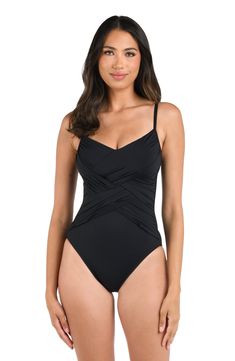 Sunbathe seaside in this draped lingerie one-piece swimsuit. The delicate and simple lingerie shape exudes a simple, feminine style. Adjustable straps and removable cups allow this piece to fit to you. Front draping, tummy control, and moderate rear coverage ensure you look and feel confident. [split] Details One piece swimsuit Draped front Removable cups Adjustable straps Tummy control Fabric 83% Nylon, 17% Elastane Simple Feminine Style, Compressive One-piece Swimwear With Lined Body, Black Compressive Swimwear With Lined Body, Black One-piece Swimwear With Lined Body, Black One-piece Swimwear With Adjustable Straps, Black V-neck One Piece For Poolside, Swimsuit Material, Tanning Lotion, Sun Tan