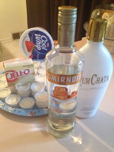 an empty bottle and some other items on a table