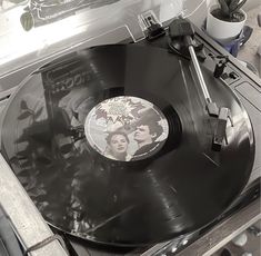 an old record player with elvis and mary popper on it's turntable